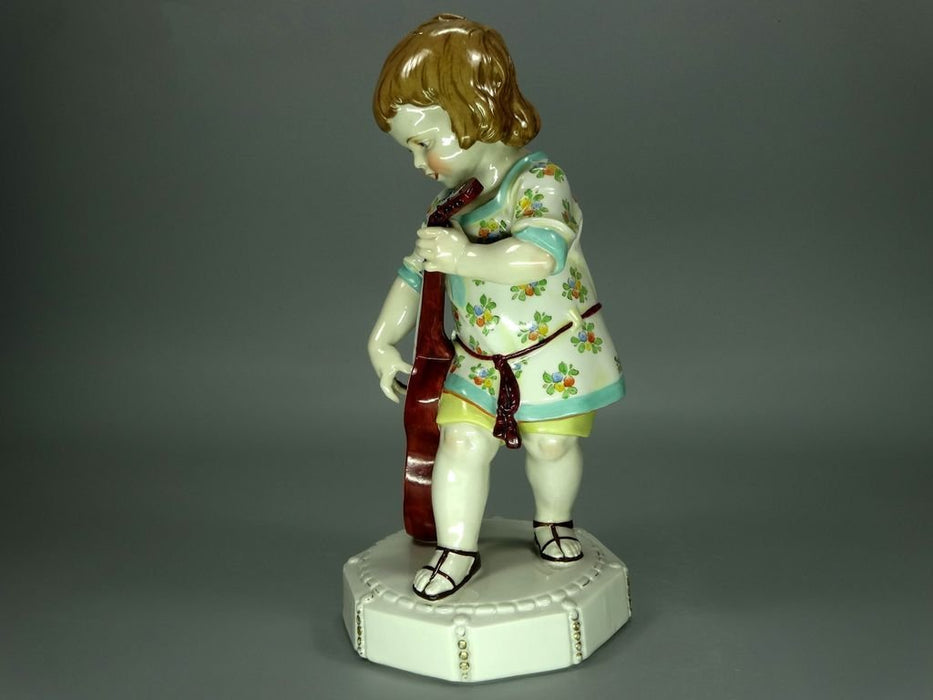 boy with guitar figurine